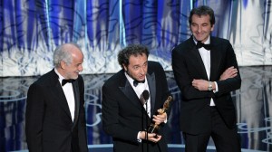 Actor Toni Servillo, director Paolo Sorrentino, and producer Nicola Giuliano accept the Best Foreign Language Film award for 'The Great Beauty' from Italy.